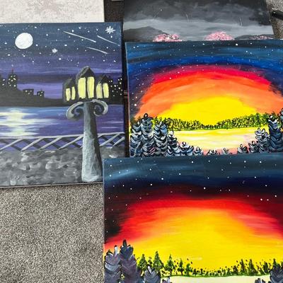 Paint by numbers kit, one canvas, and four painted canvases