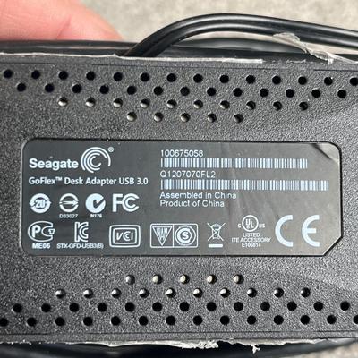 Hard drive enclosure, power cords, and miscellaneous computer