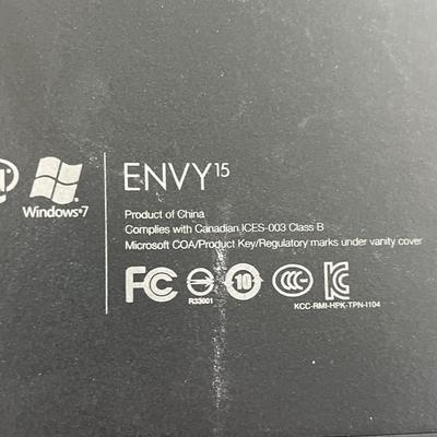 HP Envy laptop, keyboard and mouse, power strips