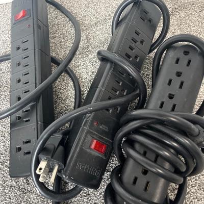 HP Envy laptop, keyboard and mouse, power strips