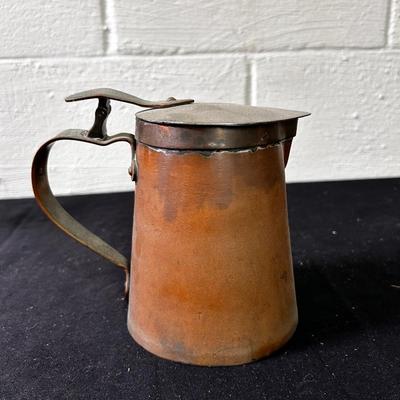 Antique copper pitcher