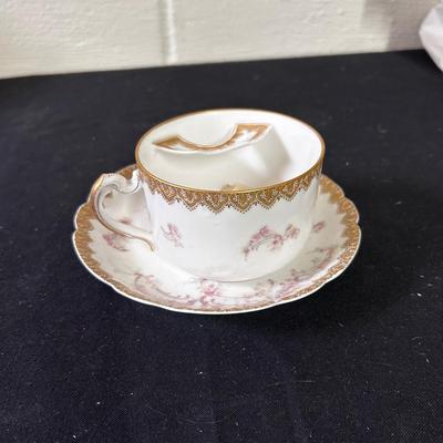 Antique mustache teacup and saucer