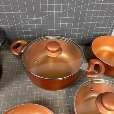 Set of Copper Colored Pots and Pans 