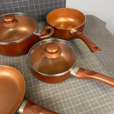 Set of Copper Colored Pots and Pans 