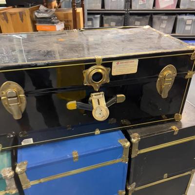 (7) Pile of Foot Locker Style Trunks 