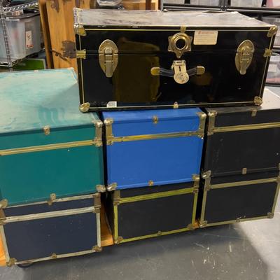 (7) Pile of Foot Locker Style Trunks 