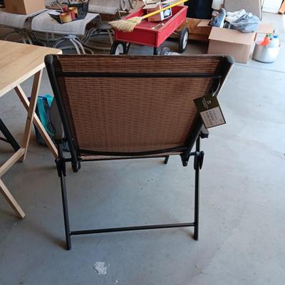 2 NEW FOLDING SLING CHAIRS, SOFT SIDED COOLER AND A FOLDING TABLE