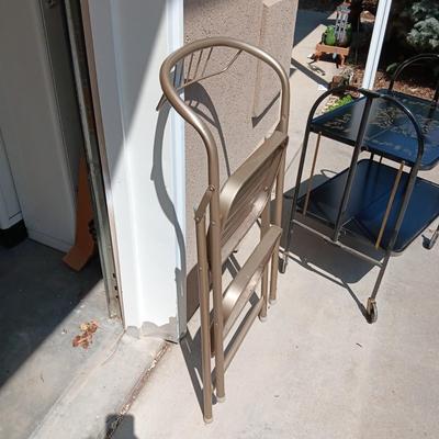 MID-CENTURY FOLDING 2 TIER CART ON CASTERS AND A FOLDING STEP STOOL