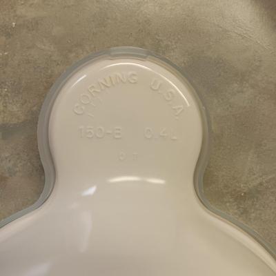 5 CORNING WARE DISHES WITH HANDLES, GLASS SHAKERS, RAMEKINS AND A GLASS CUTTING BOARD