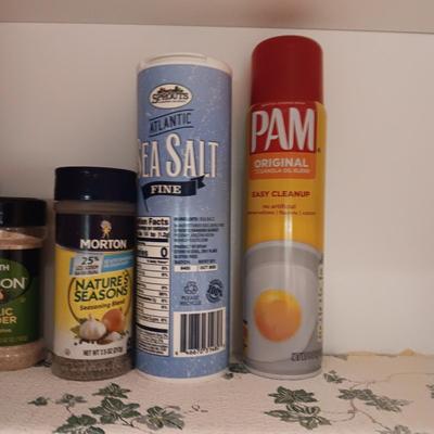 A VARIETY OF SPICES AND A SET OF SHAKERS