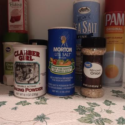A VARIETY OF SPICES AND A SET OF SHAKERS