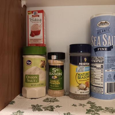 A VARIETY OF SPICES AND A SET OF SHAKERS