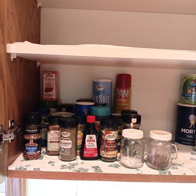 A VARIETY OF SPICES AND A SET OF SHAKERS