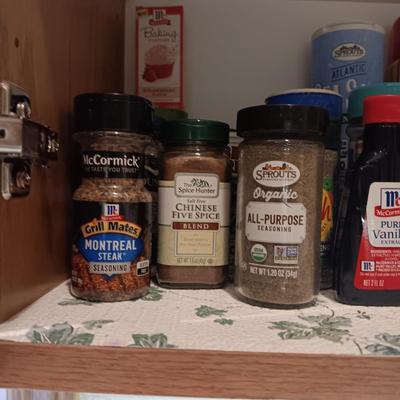 A VARIETY OF SPICES AND A SET OF SHAKERS