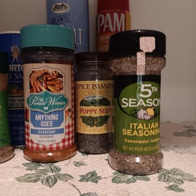 A VARIETY OF SPICES AND A SET OF SHAKERS