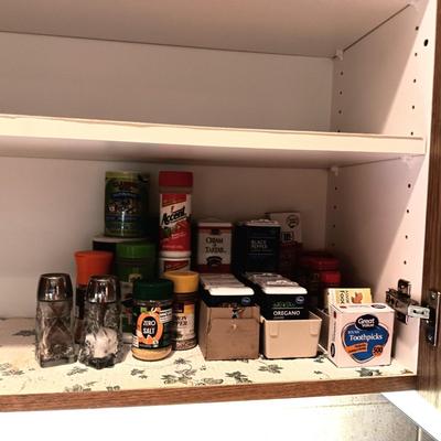A VARIETY OF SPICES AND A SET OF SHAKERS