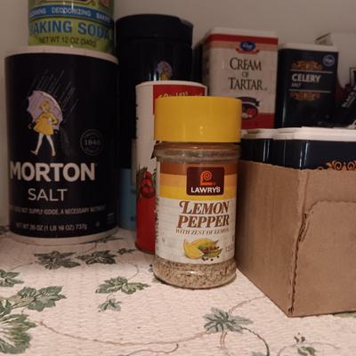 A VARIETY OF SPICES AND A SET OF SHAKERS