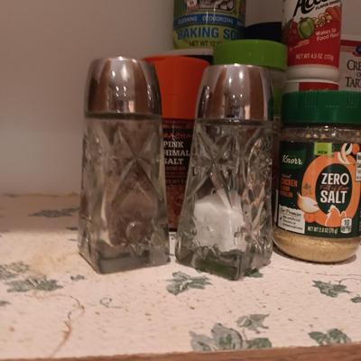 A VARIETY OF SPICES AND A SET OF SHAKERS