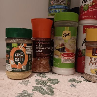 A VARIETY OF SPICES AND A SET OF SHAKERS