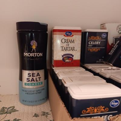 A VARIETY OF SPICES AND A SET OF SHAKERS