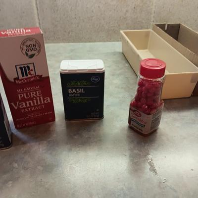 A VARIETY OF SPICES AND A SET OF SHAKERS