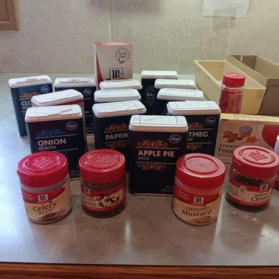 A VARIETY OF SPICES AND A SET OF SHAKERS
