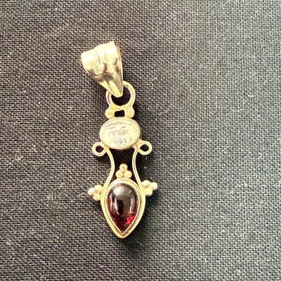 Ruby Red stone with gold pendant
