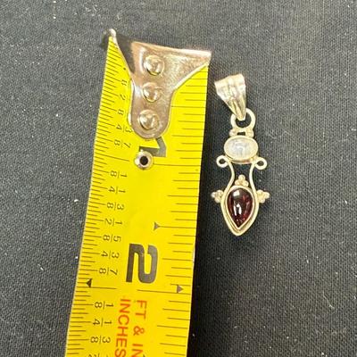 Ruby Red stone with gold pendant