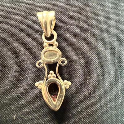 Ruby Red stone with gold pendant