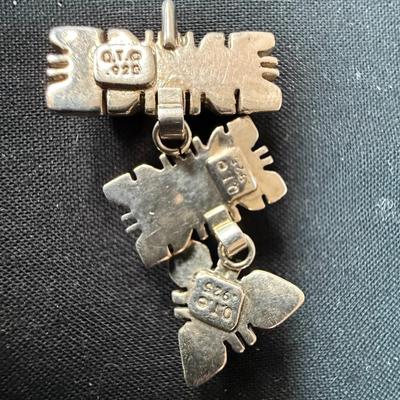 Artisan made pendant Sterling silver pendant with multiple stones.