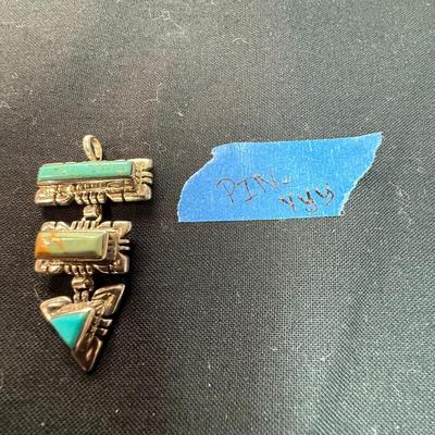 Artisan made pendant Sterling silver pendant with multiple stones.