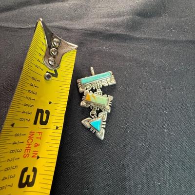 Artisan made pendant Sterling silver pendant with multiple stones.