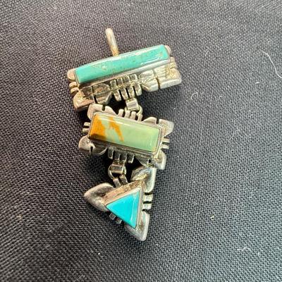 Artisan made pendant Sterling silver pendant with multiple stones.