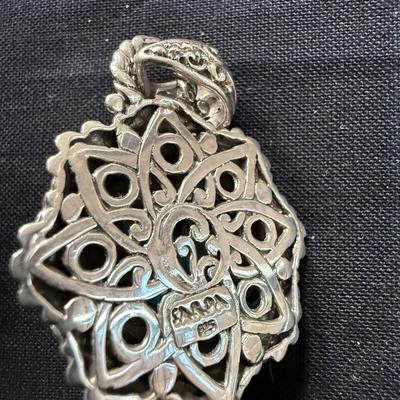 Sarda sterling silver floral pendant with carved unakite.