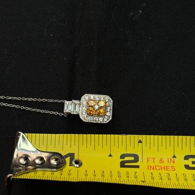 Emerald Cut Yellow Gems with white zicron