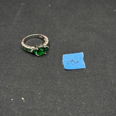 Green stone and white ring