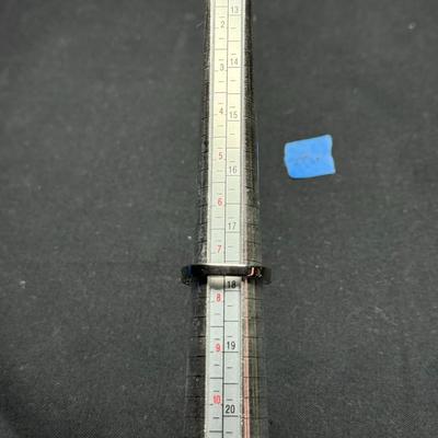 Green stone and white ring