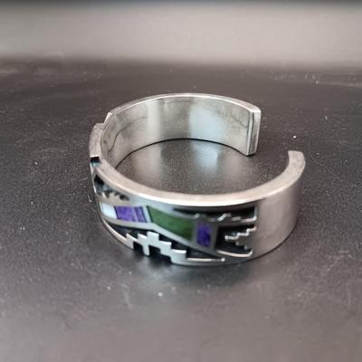STERLING SILVER BRACELET WITH PURPLE, GREEN AND WHITE STONES MARKED "AC" 73.27g