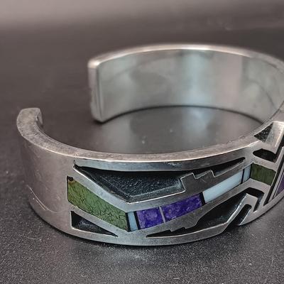 STERLING SILVER BRACELET WITH PURPLE, GREEN AND WHITE STONES MARKED "AC" 73.27g