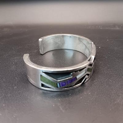 STERLING SILVER BRACELET WITH PURPLE, GREEN AND WHITE STONES MARKED "AC" 73.27g