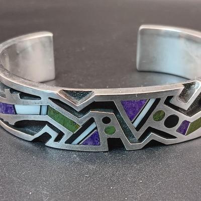 STERLING SILVER BRACELET WITH PURPLE, GREEN AND WHITE STONES MARKED "AC" 73.27g