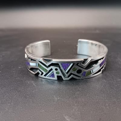 STERLING SILVER BRACELET WITH PURPLE, GREEN AND WHITE STONES MARKED "AC" 73.27g