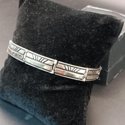 14K AND STERLING SILVER LINKED BRACELET MARKED "Calvin" 23.44g
