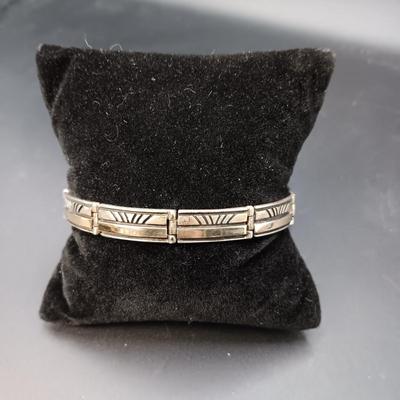 14K AND STERLING SILVER LINKED BRACELET MARKED "Calvin" 23.44g
