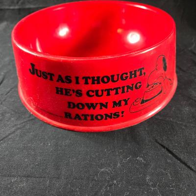 Sale Photo Thumbnail #29: This auction lot is for a 1970's Snoopy Collector Dog Bowl. This is a full-sized red plastic dog bowl.  It has graphics and wording on all sides of the red, round bowl that is in as new condition.  The bowl appears to be unused.  It is about 8-inches in d