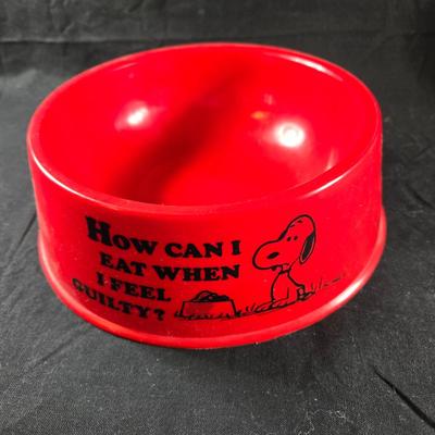 Sale Photo Thumbnail #28: This auction lot is for a 1970's Snoopy Collector Dog Bowl. This is a full-sized red plastic dog bowl.  It has graphics and wording on all sides of the red, round bowl that is in as new condition.  The bowl appears to be unused.  It is about 8-inches in d