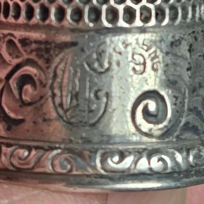 Sale Photo Thumbnail #39: This auction lot is for a Vintage Sterling Silver Thimble.  This is a very nice ornate Sterling Silver Thimble. It weighs about 6 grams  It is monogrammed with what looks like a C or G - near the worn wording of Sterling 9.  It also has a fancy S in a shi