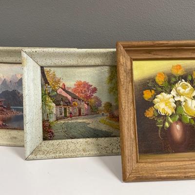 Paintings and framed decor in tote