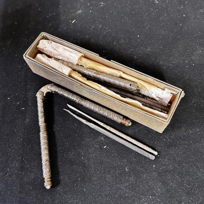 Box of vintage nut crackers and nut picks