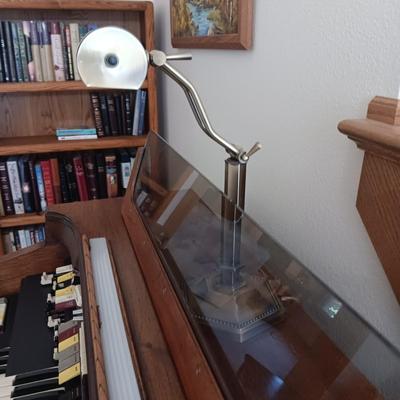 HAMMOND ORGAN WITH ALL THE BELLS AND WHISTLES, PIANO LIGHT AND A BENCH PLUS A LOT OF SHEET MUSIC